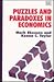Puzzles and Paradoxes in Economics