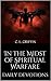 In The Midst of Spiritual Warfare Daily Devotions by C.L. Griffin