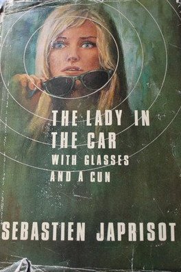 The lady in the car with glasses and a gun,
