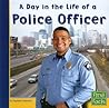 A Day in the Life of a Police Officer (Community Helpers at Work) (First Facts: Community Helpers at Work)