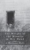 The Weight of the Minolta in Her Hand