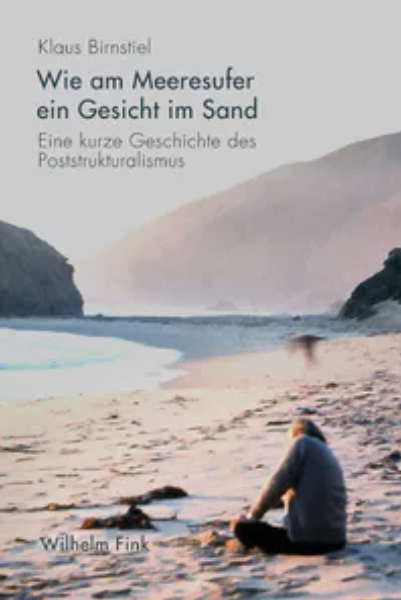 Wie am Meeresufer ein Gesicht im Sand