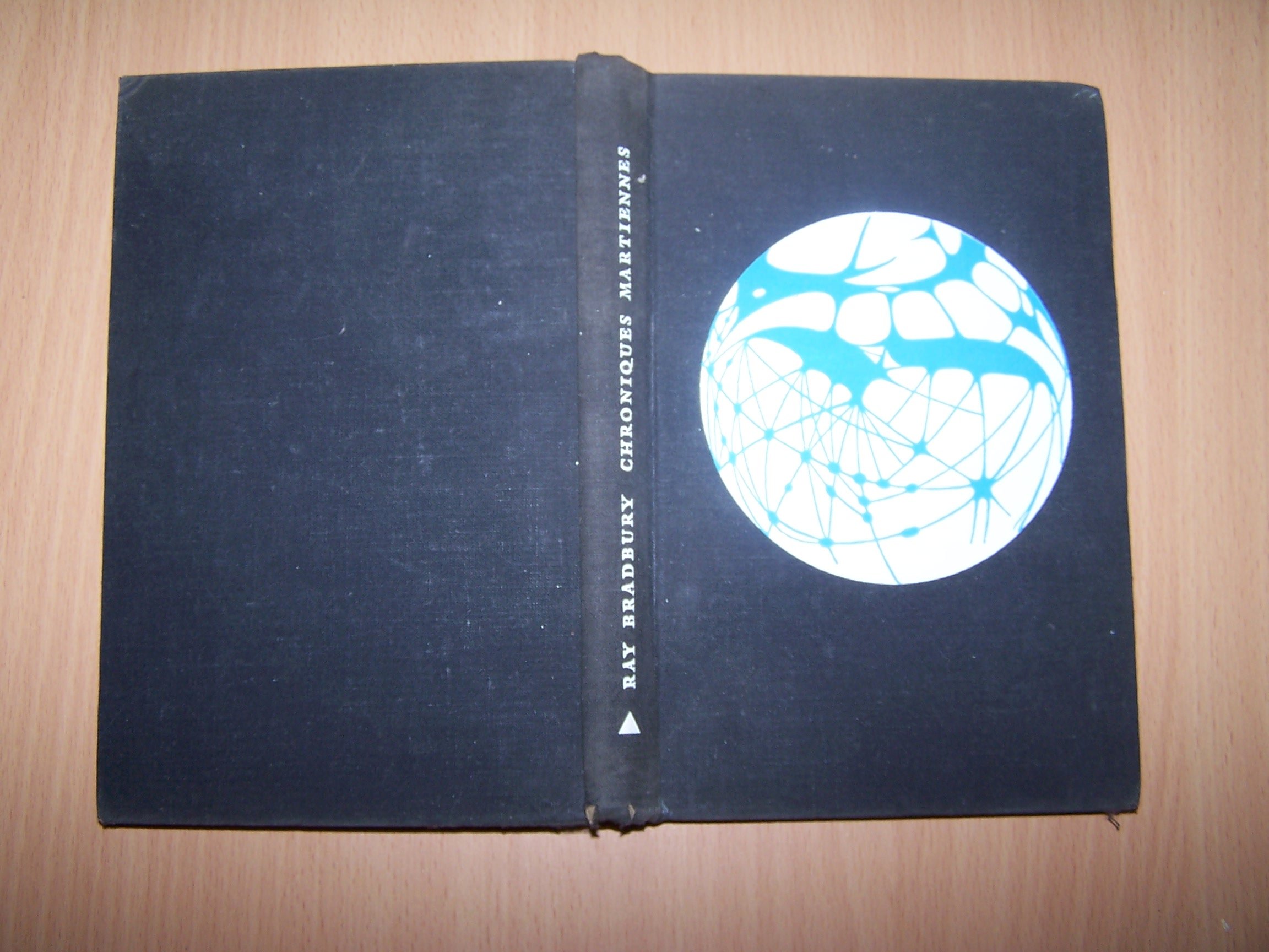 Chroniques martiennes. Illustrations de Jacques Noël. Le Club du Meilleur Livre. 1955. Reliure éditeur toile noire, rhodoïd. 234 pages. Exemplaire numéroté.