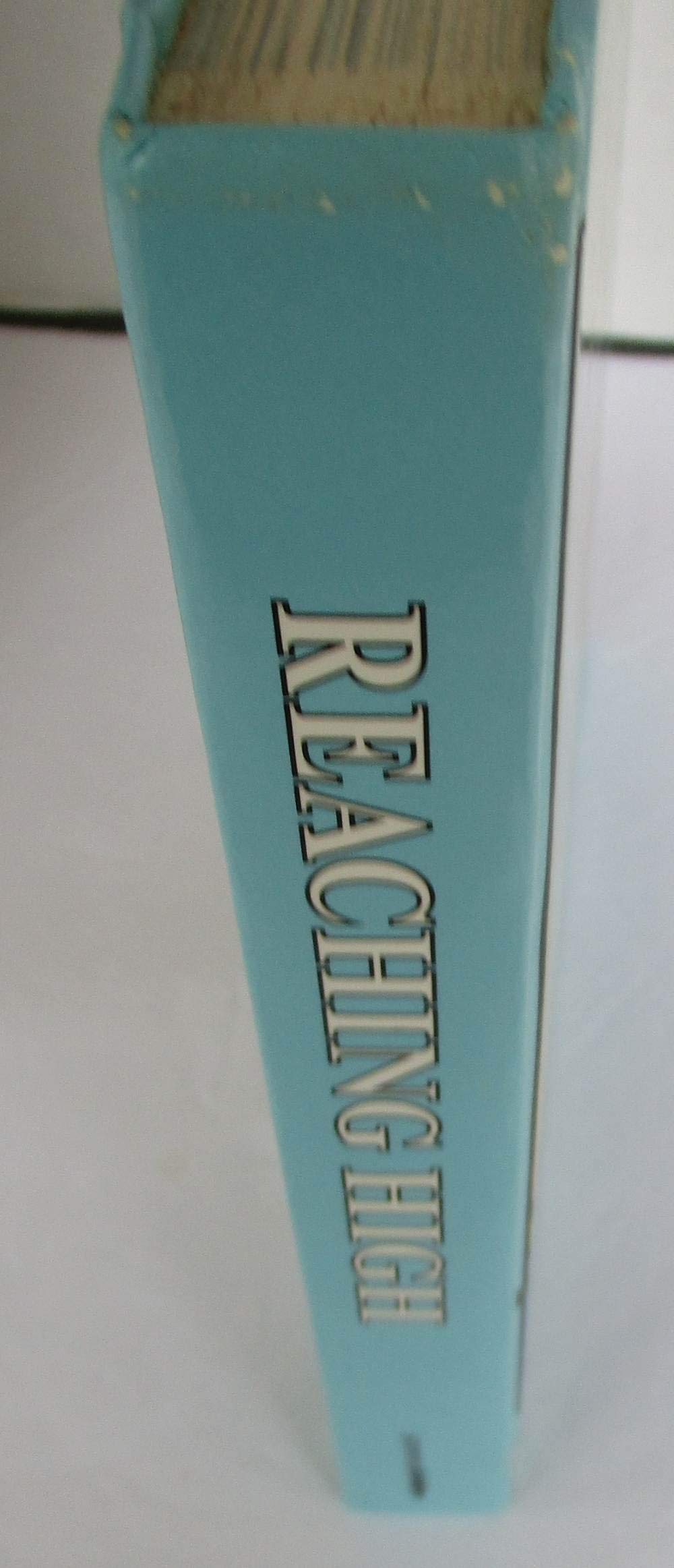 Reaching high (Scribner reading series)