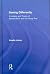 [ { SEEING DIFFERENTLY: A HISTORY AND THEORY OF IDENTIFICATION AND THE VISUAL ARTS } ] by Jones, Amelia (AUTHOR) May-02-2012 [ Paperback ]