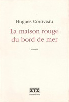 La maison rouge au bord de la mer