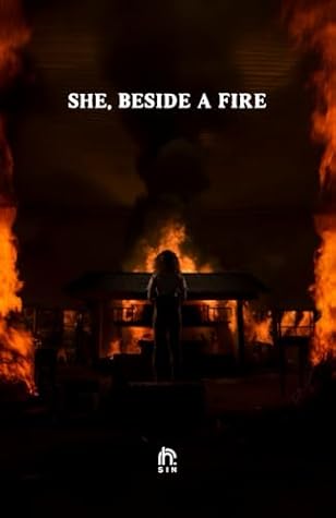 she, beside a fire