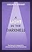 A Light In The Darkness by Adeline M. Stewart
