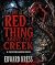 The Red Thing Above the Cre...