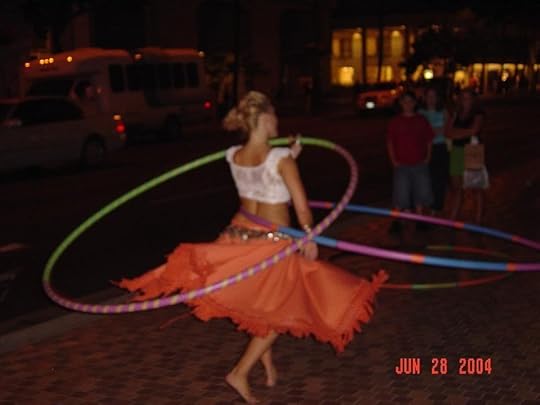 Dancing lady has 5 hula hoops going at once. shes cool Pictures, Images and Photos