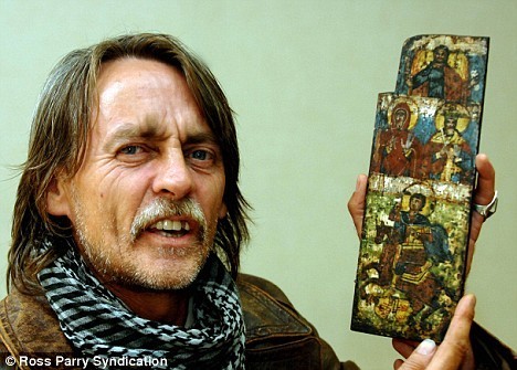 Martin Roberts with his find: The 'Knights Templar' tabarnacle door which could date back to 700AD