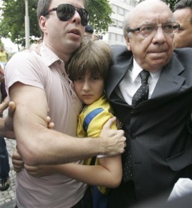 The very public return of Sean Goldman to his father David Goldman (Sean is pictured with his Brazilian stepfather, Joao Paulo Lins e Silva