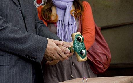 Daigo Teshima and his wife Saori smash a ring during divorce ceremony