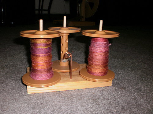 two bobbins of singles