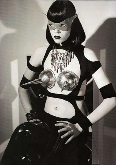 dominatrix wearing pointy bra