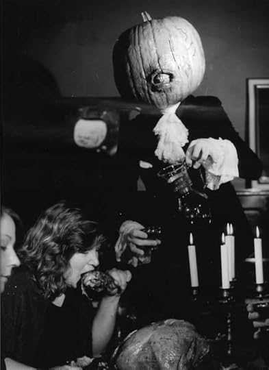 women eating hallucinogenic turkey with pumpkin-headed man
