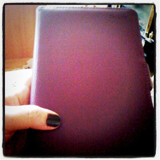 Kindle in purple case (closed)