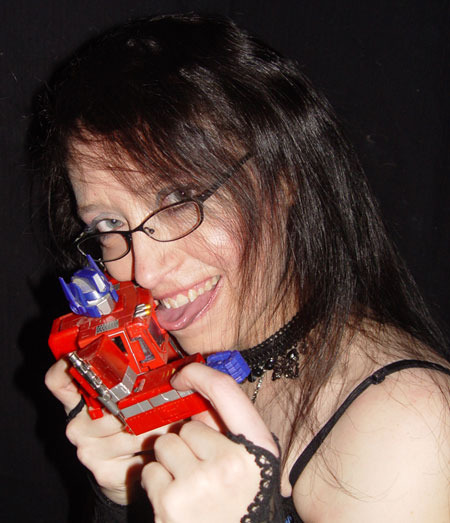 Rose 'Screamer' Ward licking Transformer Optimus Prime in a little Geeky Fun
