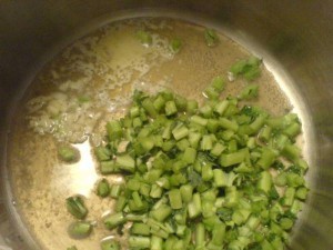Kale, chicken broth and butter over medium heat