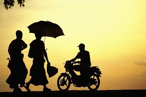 8-550-2 stock photo of Laos, Vientiane, Monks on riverbank