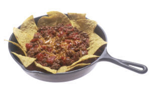 beef, beans, and cheese on a bed of tortilla chips