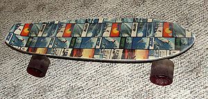 1970s Surfer print fiberglass skateboard
