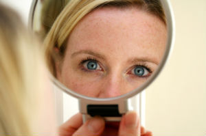 Photo of woman-with-mirror-for-social-media-make-over