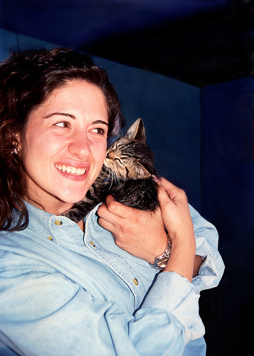 kitten kissing woman