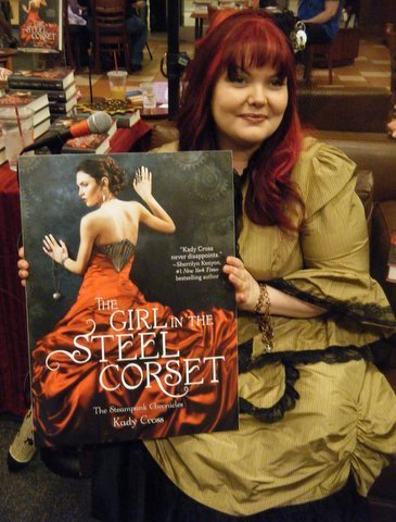 With one of the posters for the event