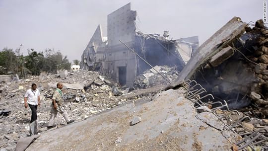Libyans take journalists on a guided tour of destroyed buildings where Moammar Gadhafi had his base in Tripoli.