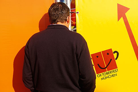 3-954-41 stock photo of Germany, Munich, Oktoberfest, Looking through the fence