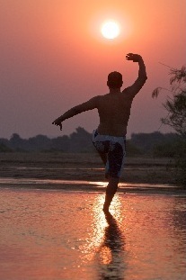 Facing the African sunset practicing Taoist Kung Fu