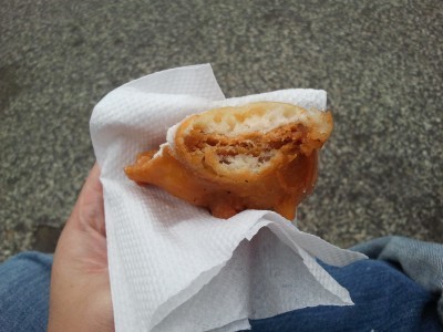 a deep fried Nutter Butter cookie with a bite taken out of it
