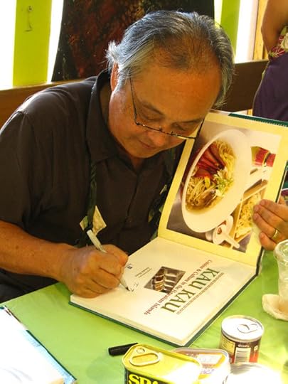Author Arnold Hiura and his book Kau Kau