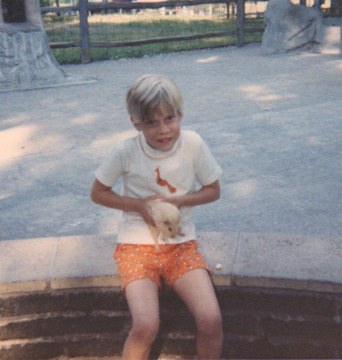 Squeezing a guinea pig at the Cleveland Zoo. (1967)