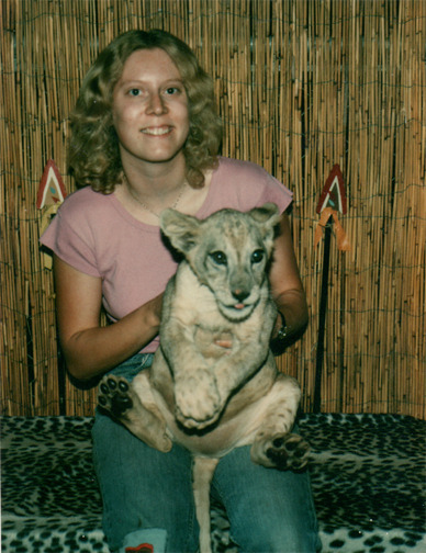 Holding a baby Black Maned lion at a roadside attraction. (1978)