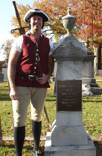 Peter Francisco beside his own grave at Shockoe Hill Cemetery