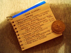 Future Dave looks back at his teeny half notebook! Such high scores! Silver dollar included for scale.