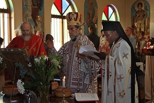 Archbishop Damaskinos blessing the Slava Kolach (photo by Zinon Marinakos)