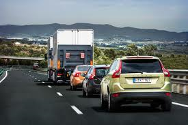 A road train; a double truck and three cars