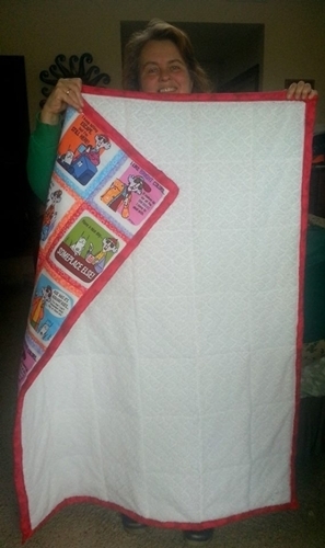 photo of Sheri holding the blanket