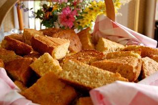 Cornbreads, sliced, in basket, flowers
