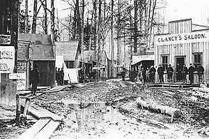 Sailing to Alaska English: Muddy street scene, Skagway, Alaska, ...