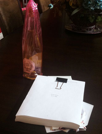 My printed manuscript and the bottle of wine my friend Kim brought me. Super Sweet!!