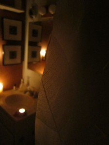 A candlelit bathroom makes showering a dreamy experience.