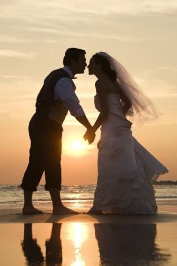 Bride and groom kissing.