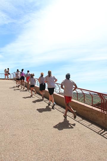 A young group of runners (pre-teen girls) going all the way to the top. Look at them go!