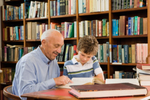 Grandpa and grandson reading