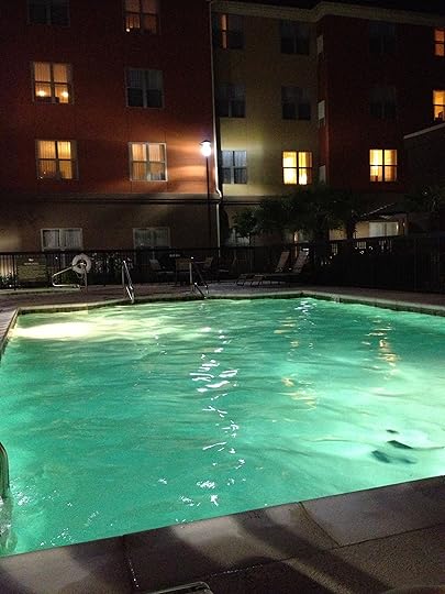 The Homewood Suites' swimming pool at night.