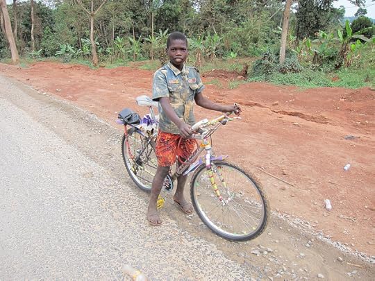 Young Boy interested in cycling around the world with a cool bicycle